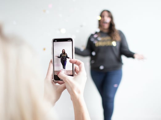 Brand follower being filmed for Instagram challenge 