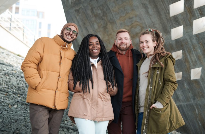 a group of young adults smiling