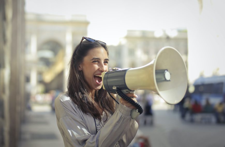 woman speaking into a megaphone