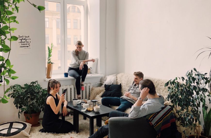 young people chatting and lounging in their living space