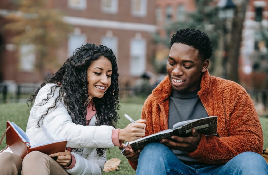 female student helping male student study