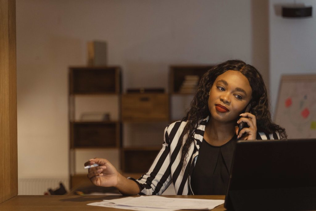 Marketer finding brand ambassadors while interviewing one on the phone