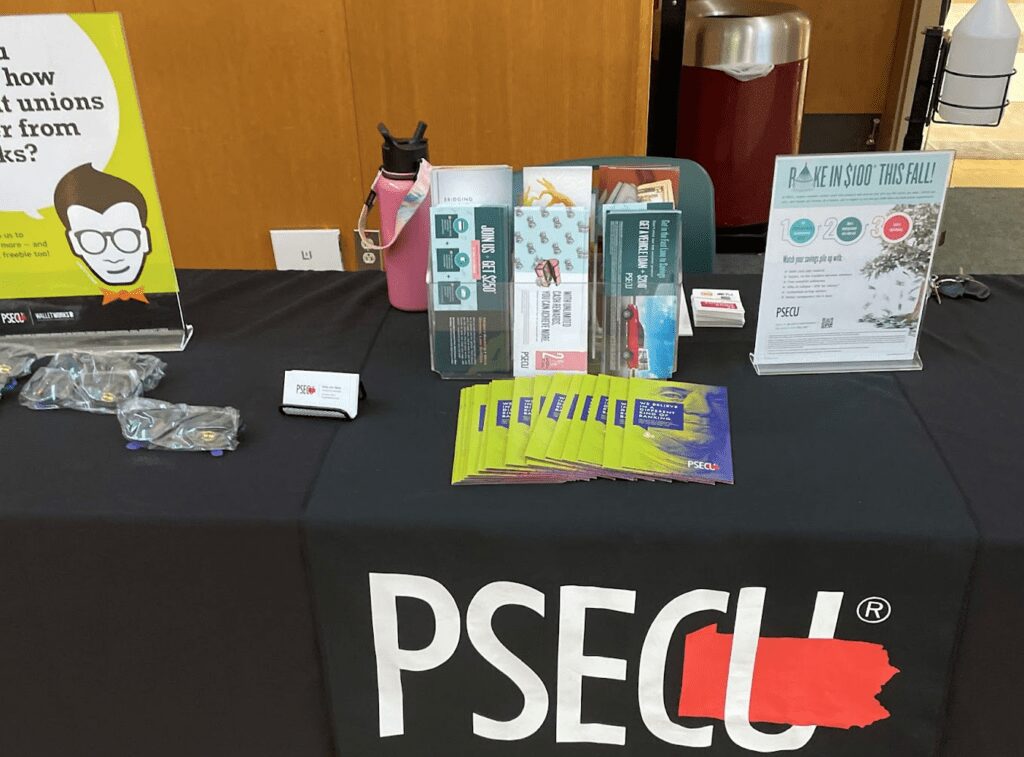 PSECU table with flyers on campus